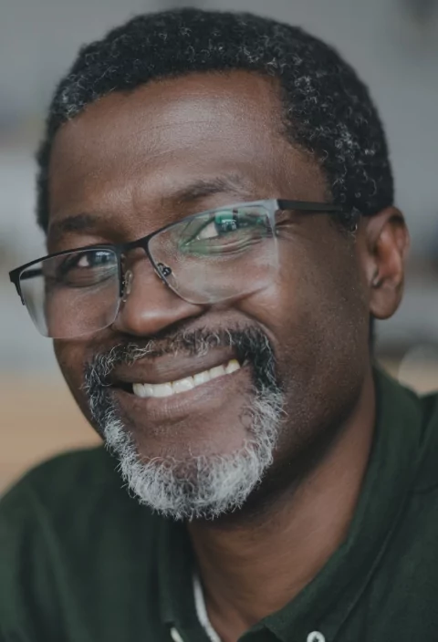 man with glasses smiling